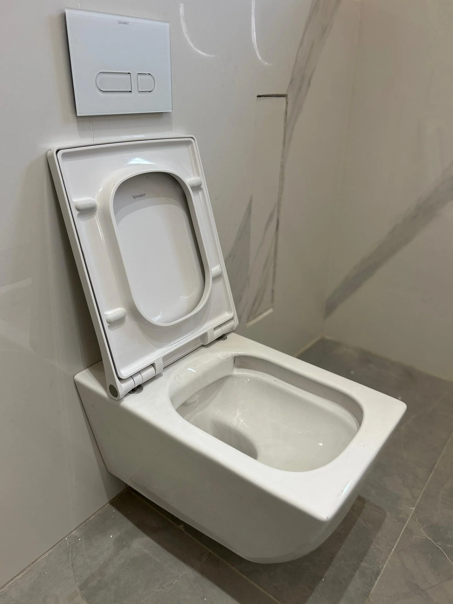 Close view of a precisely aligned wall-hung WC installation